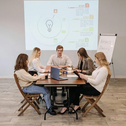 A team working at a table. 