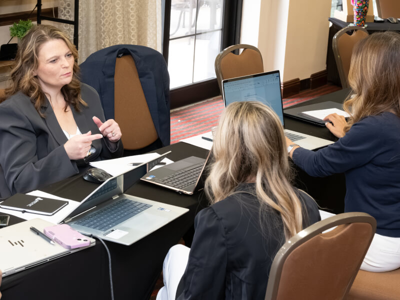 enSYNC team members collaborating in the office