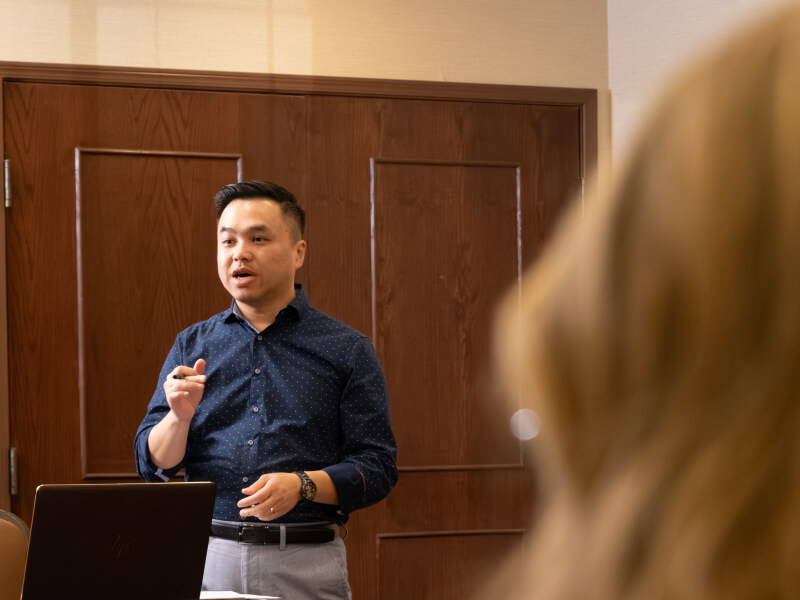 enSYNC team member presenting to colleagues