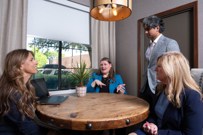 enSYNC team members collaborating in the office