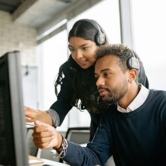 IT professional monitoring systems on multiple screens