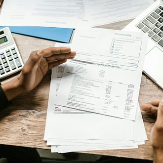 Finance professional comparing accounting options on screen