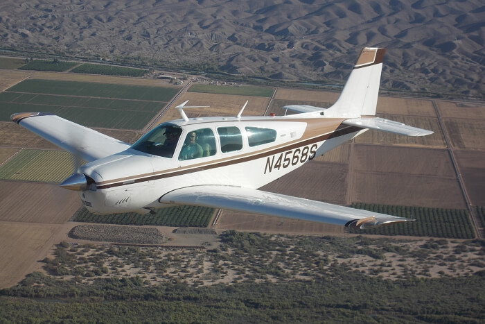 Bonanza aircraft in the air
