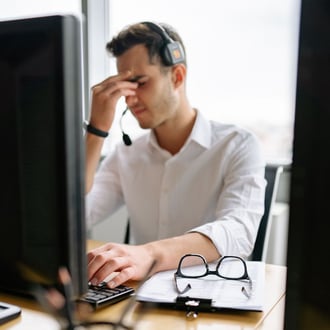 man stressed at computer