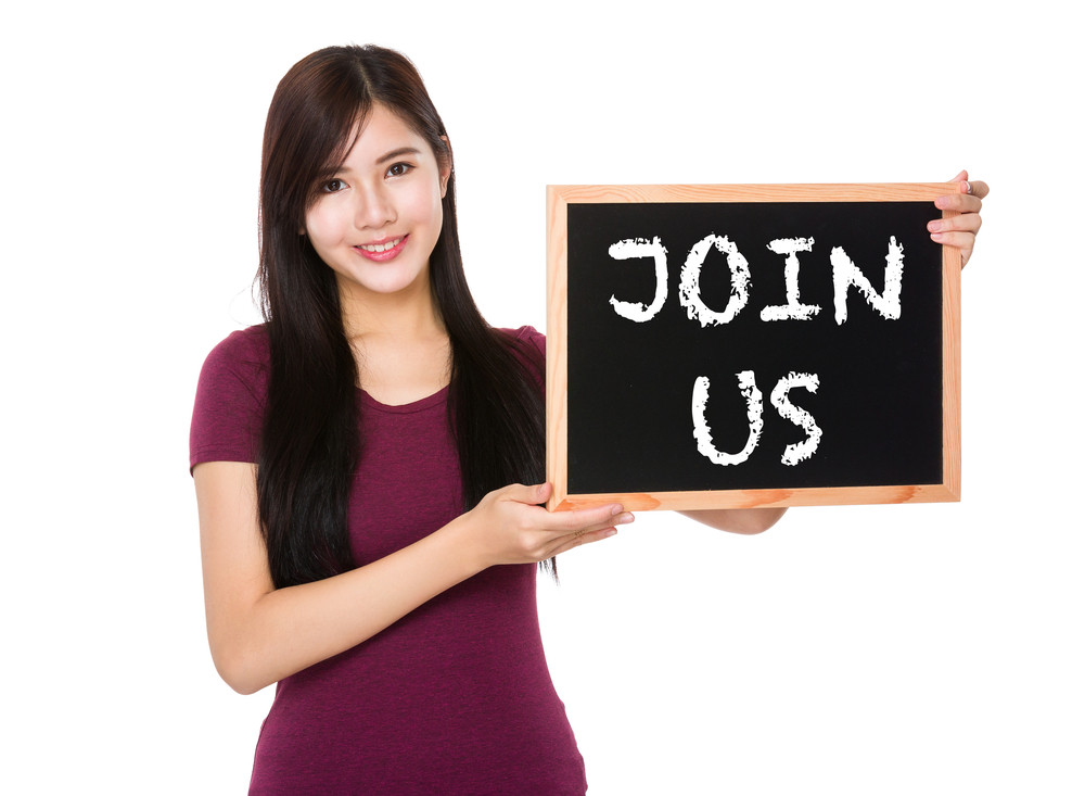 Asian woman hold with the blank chalkboard showing join us on board