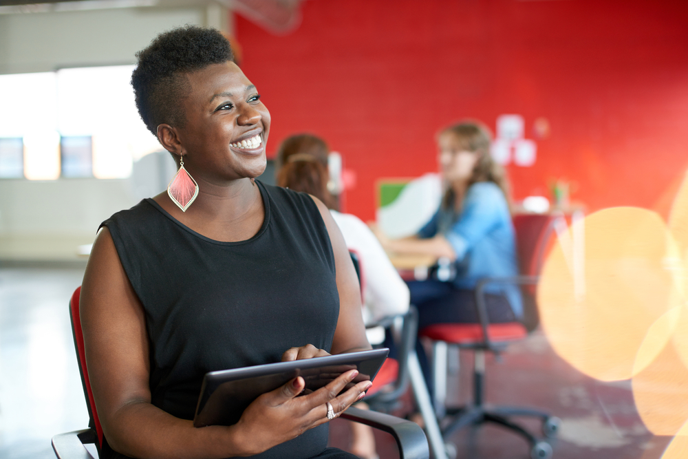 Confident female association member participating in online learning opportunity