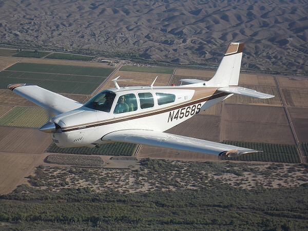 Bonanza aircraft on an airport runway